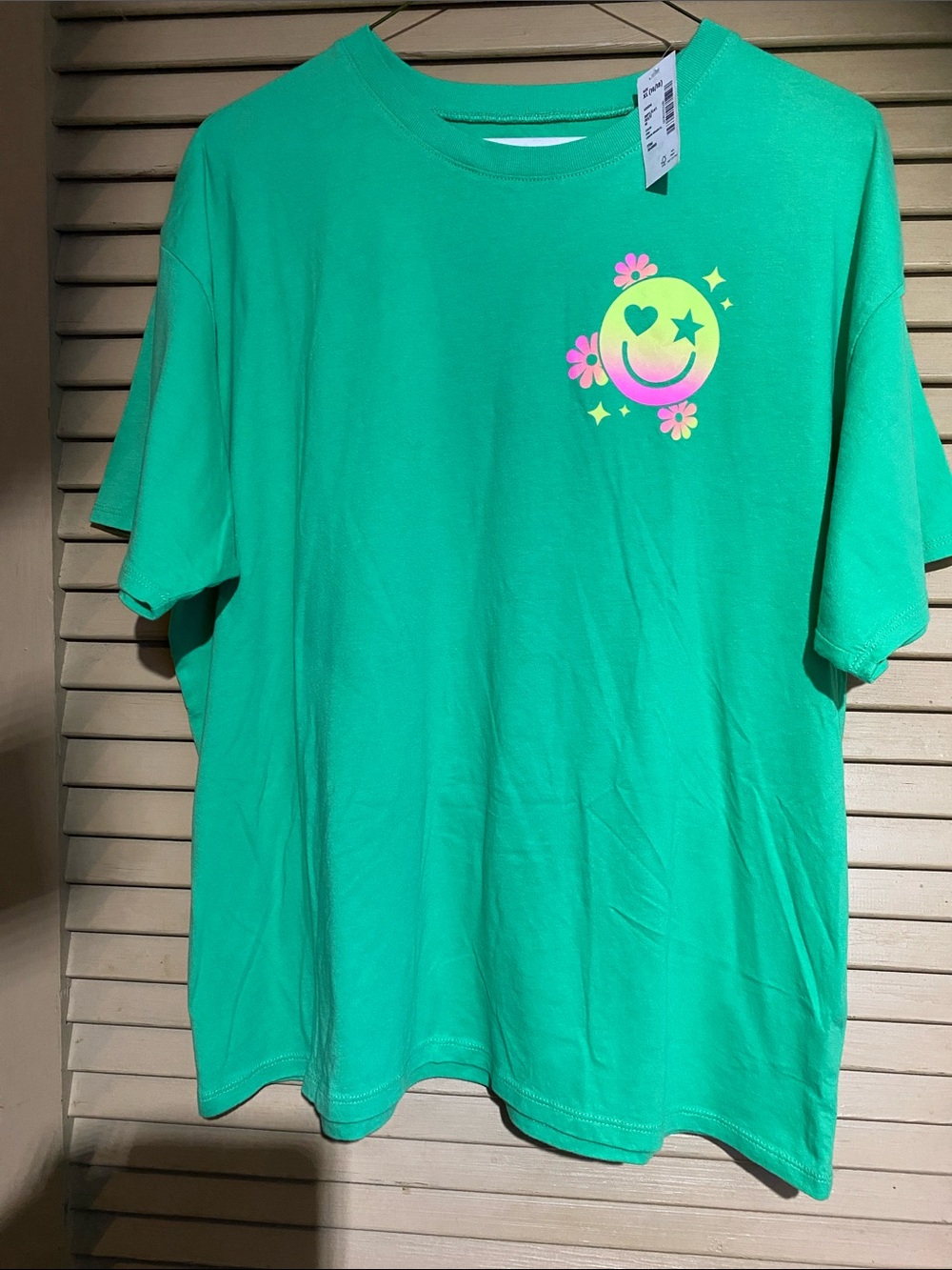 Sugar Green Tee with Neon Smiley and Pink Flower Accents